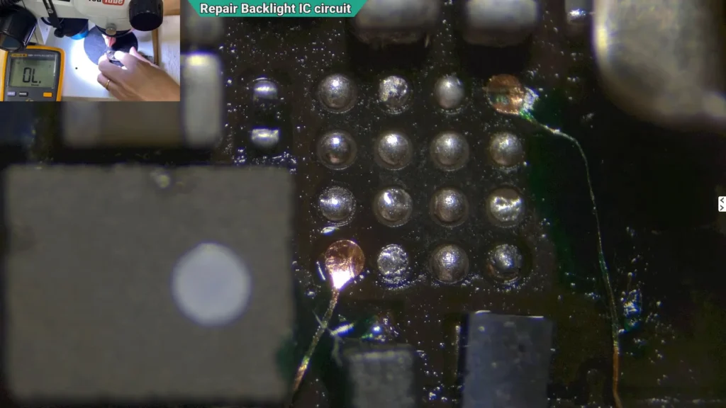 Microscope image showing reconstructed solder pads secured with UV mask and prepared for installation of a replacement backlight IC.