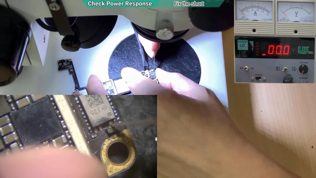 Microscope image showing the iPhone motherboard after the suspected capacitor was removed during fault diagnosis.