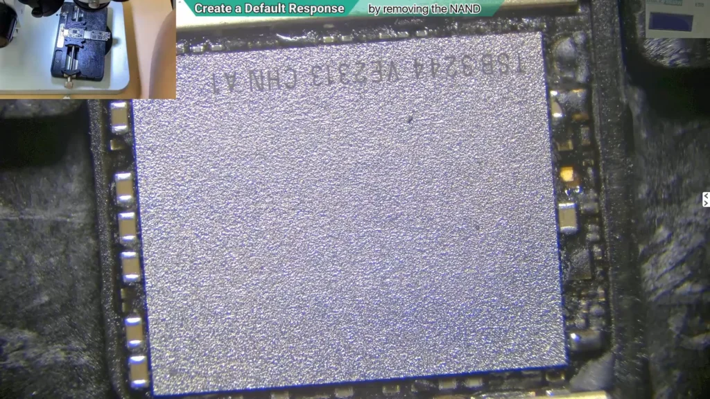 Microscope image of the NAND flash memory on a water-damaged iPhone motherboard before removal for diagnostic testing.