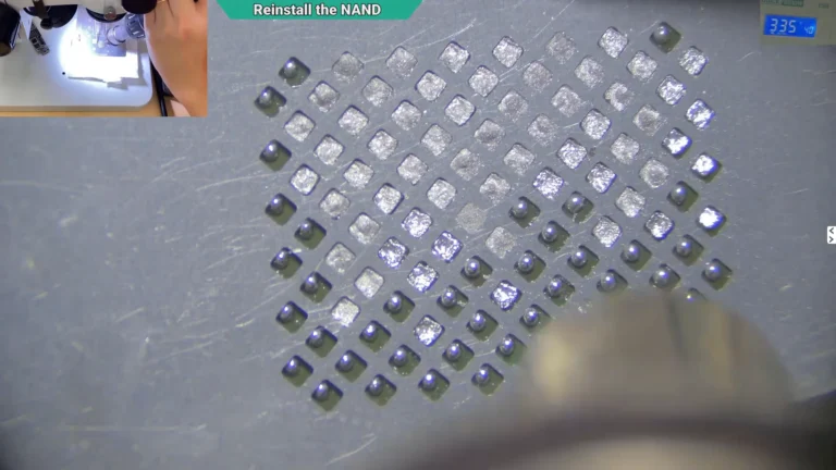 Microscope image showing new solder balls being formed on the original NAND using a stencil and hot air.