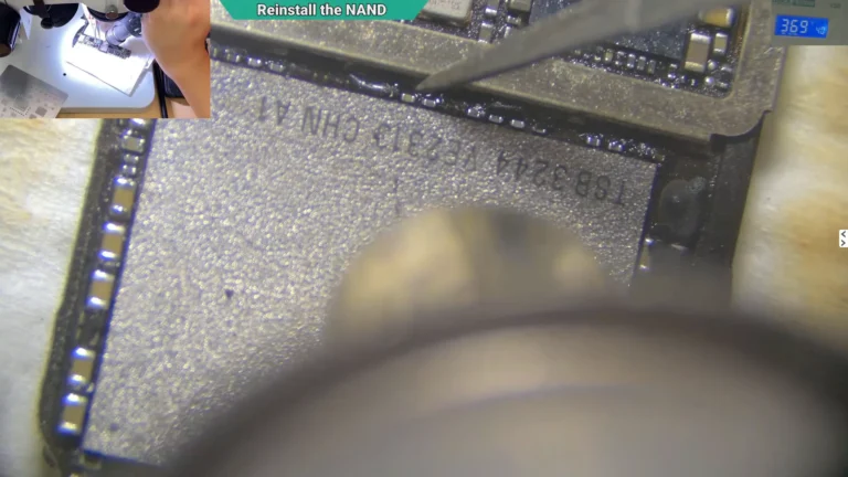 Microscope image showing the original NAND being soldered back onto the iPhone motherboard using hot air.