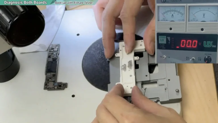 Installing the upper fixture plate to secure the separated iPhone 13 motherboard before testing.