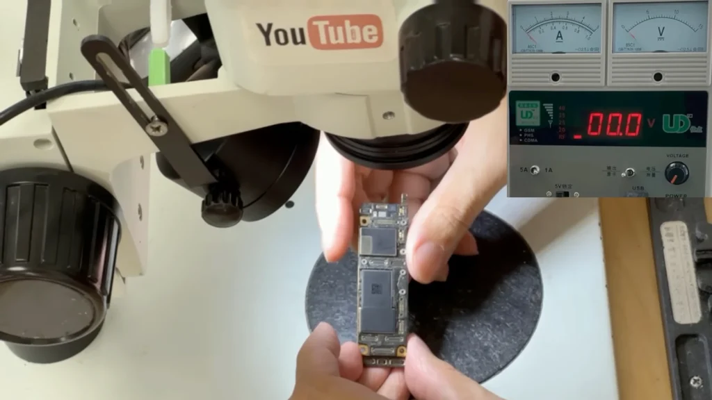 iPhone 11 logic board removed for inspection before CPU diagnosis