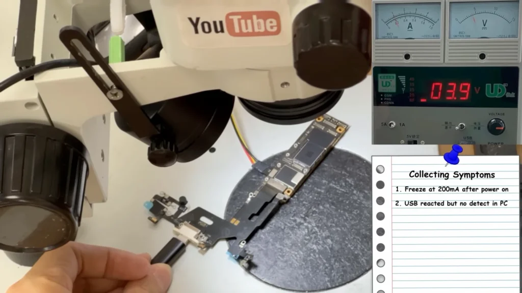 iPhone 11 logic board tested for USB detection while current remains around 200mA