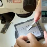 Applying solder paste with a stencil during iPhone 11 sandwich board reballing
