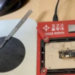iPhone 11 sandwich logic board layers joined using a preheater