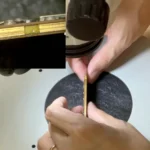 iPhone 11 sandwich board connection inspected under a microscope