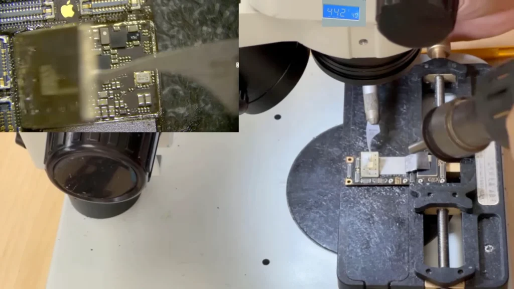 iPhone 11 motherboard components exposed beneath the CPU area shield