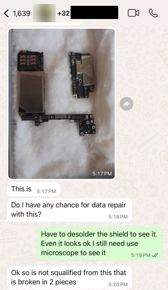 Customer photo showing an iPhone motherboard physically broken into two pieces