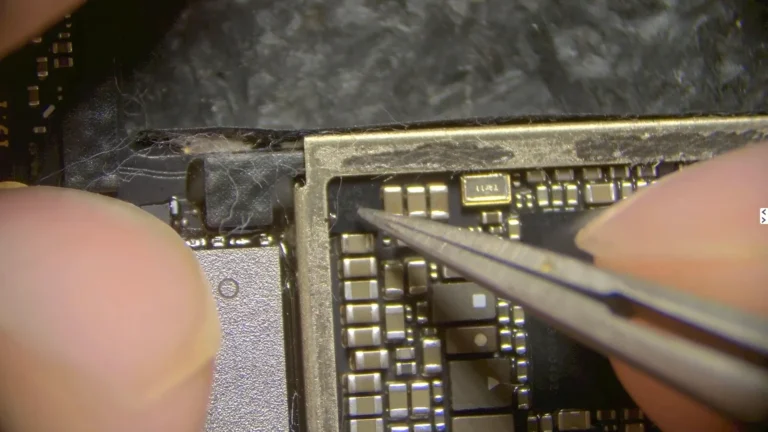 Microscope inspection of the original iPhone logic EEPROM during data recovery diagnosis