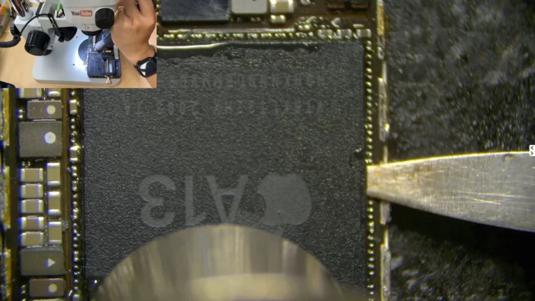 Removing Original iPhone CPU | Original iPhone CPU being removed from the damaged motherboard using controlled hot air and a blade