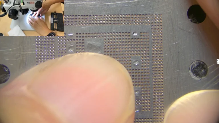 Preparing Original iPhone CPU for Reballing | Reballing stencil positioned over the original iPhone CPU before applying solder paste