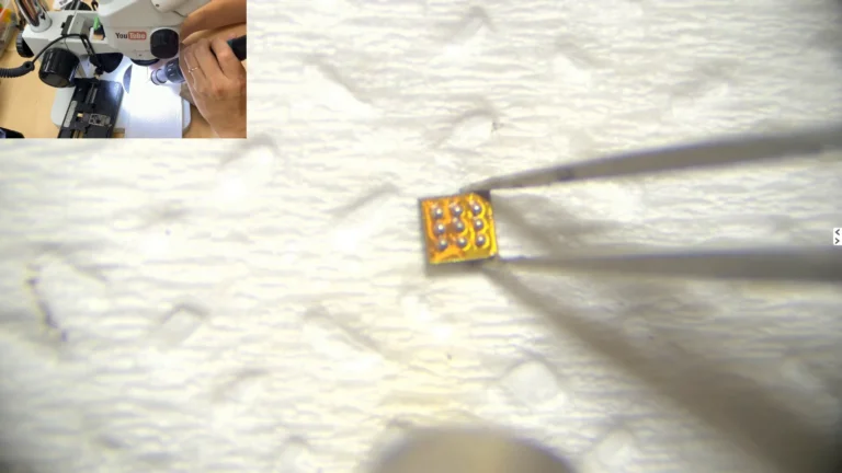 Original iPhone logic EEPROM with new BGA solder balls after reballing