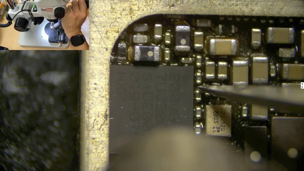 Original iPhone NFC IC being removed for transfer to the donor motherboard