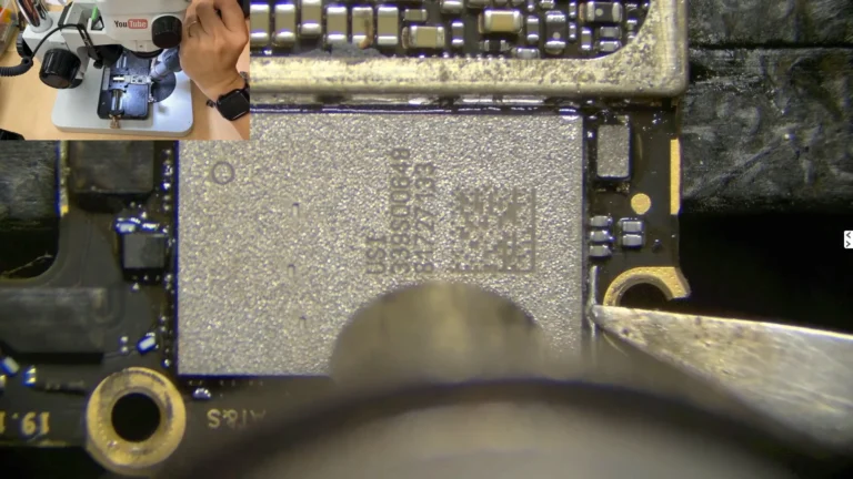 Original encrypted Wi-Fi IC being removed from the damaged iPhone motherboard